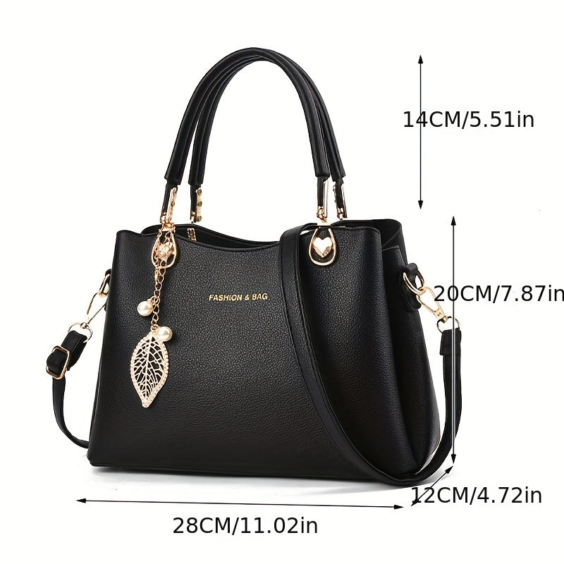 Handtas dames – elegant met gouden details en bedel