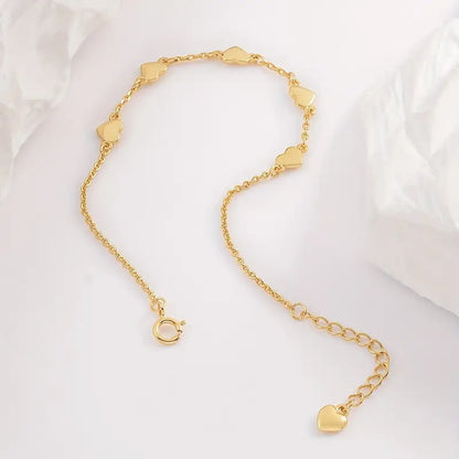 Gouden hartjes armband – 6 fijne hartjes