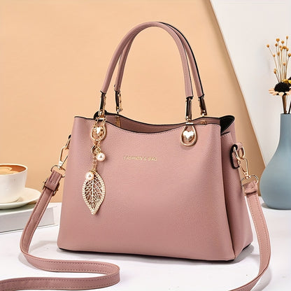 Handtas dames – elegant met gouden details en bedel