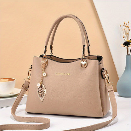 Handtas dames – elegant met gouden details en bedel