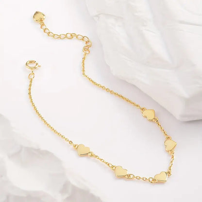 Gouden hartjes armband – 6 fijne hartjes